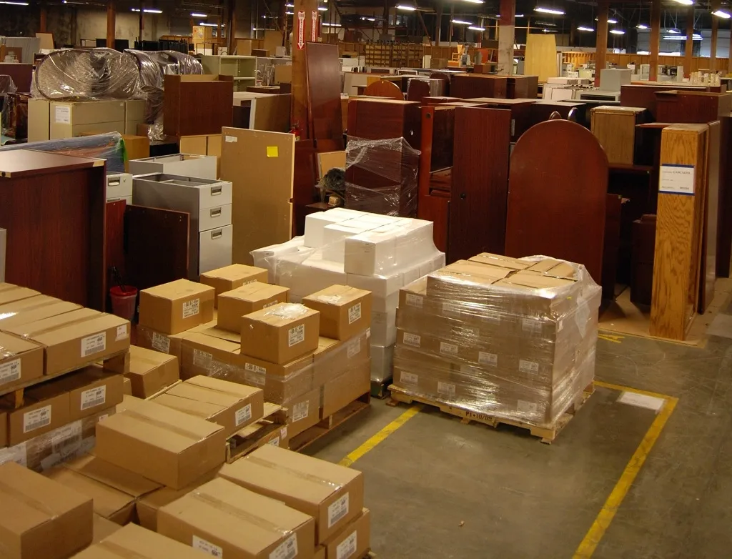 Palletized furniture and boxes in the Rose City warehouse